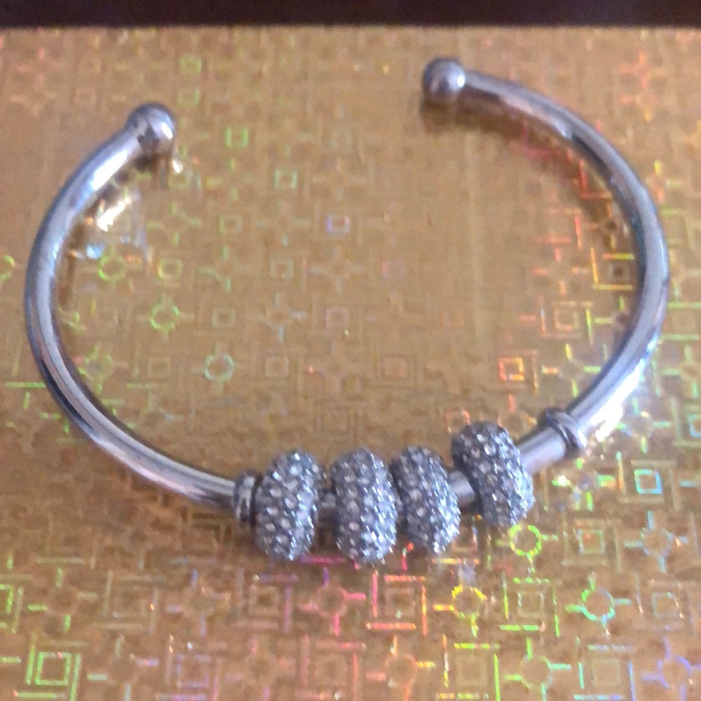 NWOT silver tone cuff with round charms